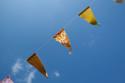 A picture of bunting stretched across a clear blue sky